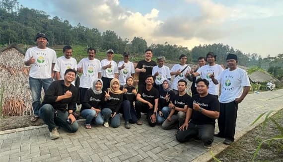 Group of team members posing outdoors together