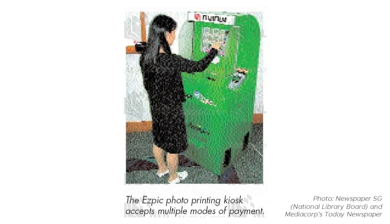 In 2004, Fujifilm Singapore and PictureWorks, a Singapore-headquartered digital imaging solutions provider, developed the Ezpic Machine. It was Singapore&rsquo;s first digital imaging self-service kiosk accepting multiple modes of payment &mdash; from cash to Cash Cards. Photo: Newspaper SG (National Library Board) and Mediacorp&rsquo;s Today Newspaper