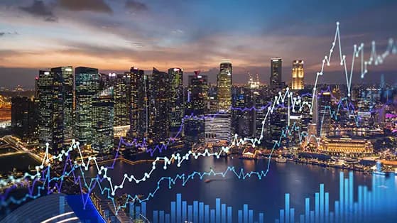 City skyline at night with overlaid financial data charts