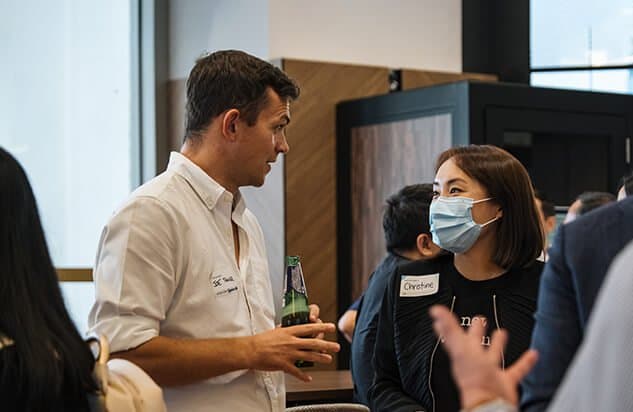 Man and woman talking at a networking event