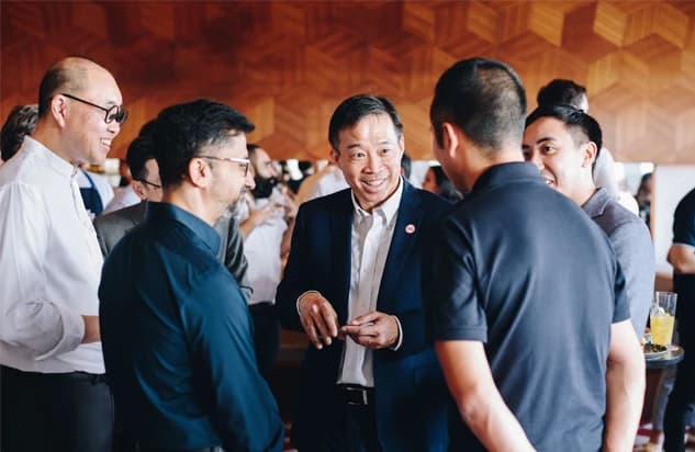 Businessmen in animated conversation at a networking event
