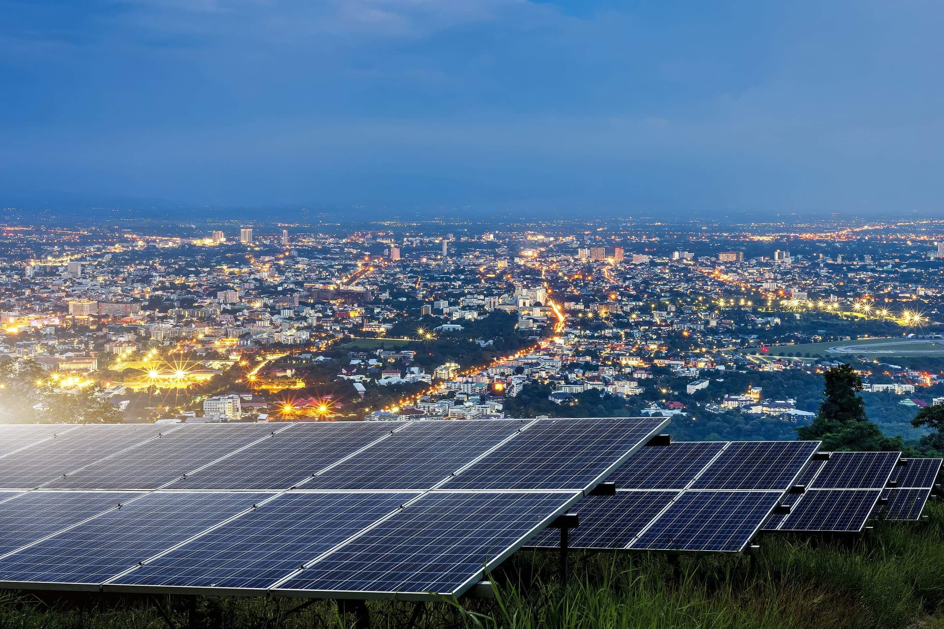 bigstock Solar Panel With City Night Ar 328084420