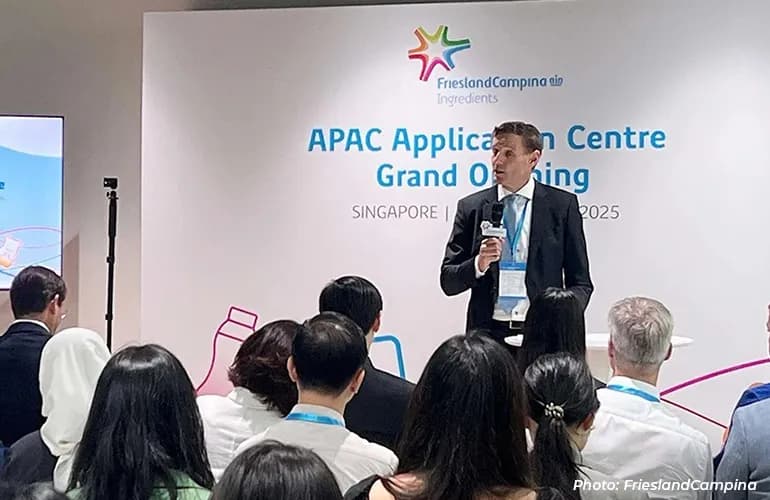 Man speaking to an audience at the FrieslandCampina APAC Application Centre grand opening event.