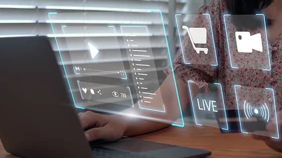 Person at laptop with digital livestream and shopping icons