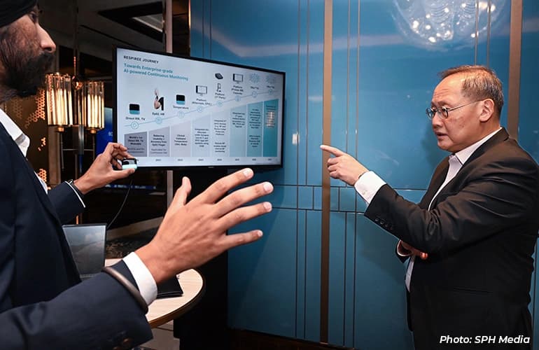Dr Gurpreet Singh (left), founder & CEO of Respiree, showing the device to Dr Tan See Leng.