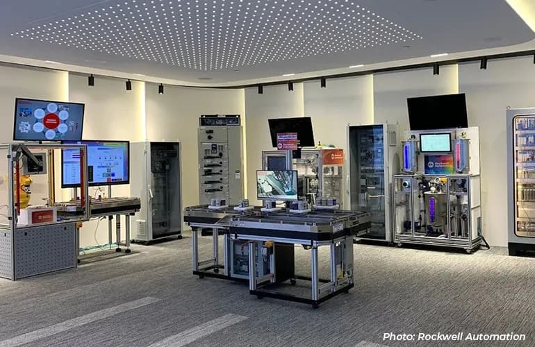 A technology showroom featuring industrial automation equipment, control systems, and digital displays arranged for demonstration.