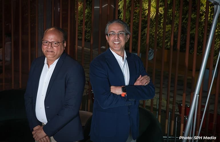 British International Investment managing director Srini Nagarajan and FAST-P chief executive Munib Madni at a solar panel farm.