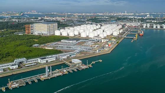 Aerial view of a coastal storage tank and refinery terminal