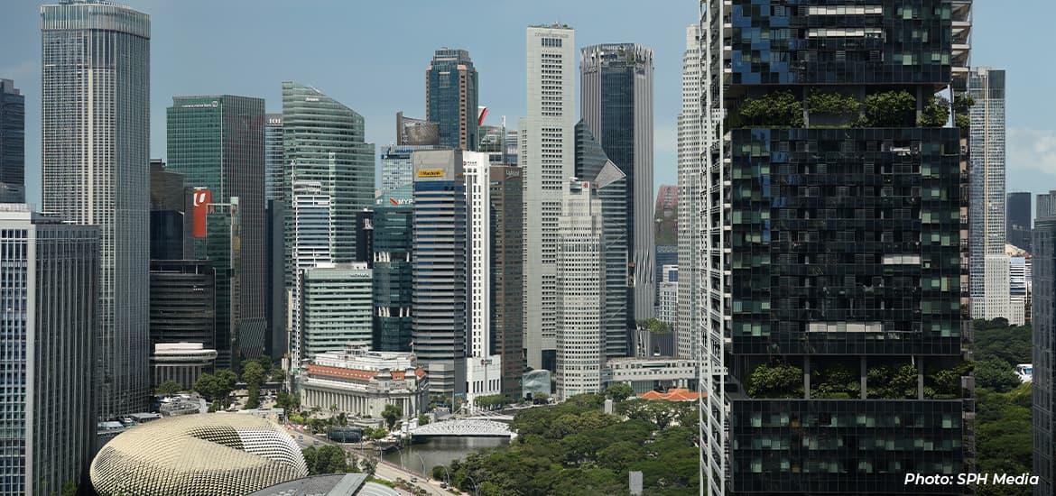 Singapore's Central Business District skyline featuring modern office towers, Marina Bay financial district buildings, and the Esplanade in the foreground.