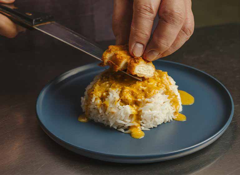 Cultivated chicken curry rice being served in Singapore.