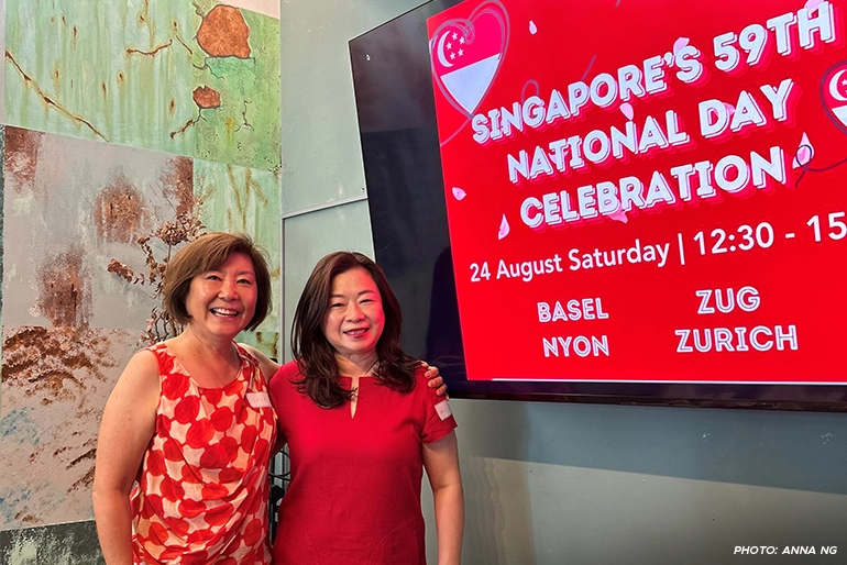Anna Ng (right) attending the National Day reception held by Temasek Club Basel, with organiser Lena Hwang.