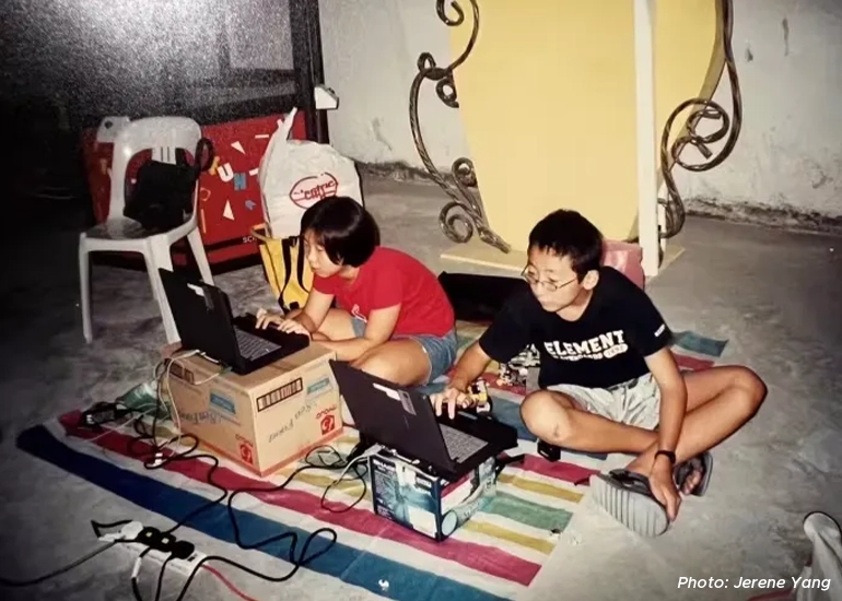 An old photo of 12-year-old Jerene Yang (left) coding Lego robots for the National Junior Robotics Competition with a classmate in 2001.