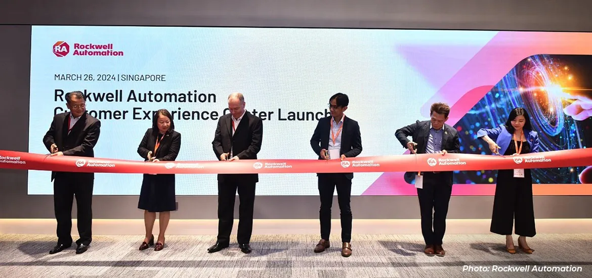 A group of executives participating in a ribbon-cutting ceremony for the launch of a Rockwell Automation Customer Experience Center in Singapore.