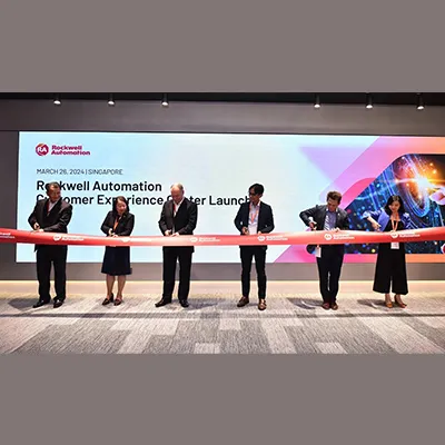 A group of executives participating in a ribbon-cutting ceremony for the launch of a Rockwell Automation Customer Experience Center in Singapore.