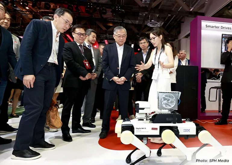 Deputy Prime Minister Gan Kim Yong viewing a demonstration of a robot at the Lenovo booth at the Singapore Week of Innovation and Technology 2025 on 29 October.