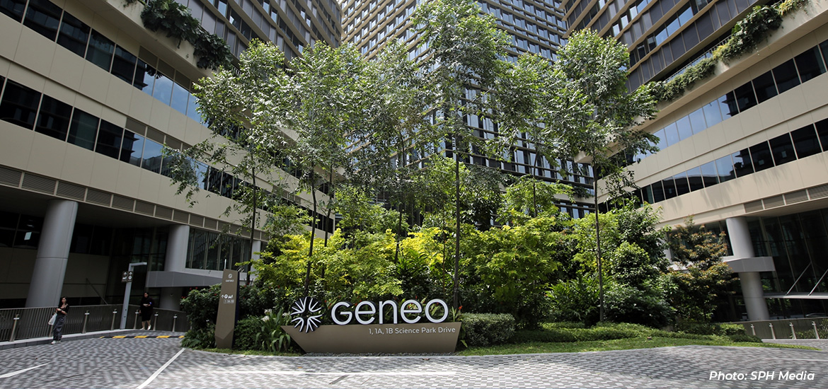 Exterior view of Geneo at Singapore Science Park, featuring a landscaped central courtyard with lush greenery surrounded by modern office and research buildings designed to support innovation and collaboration.