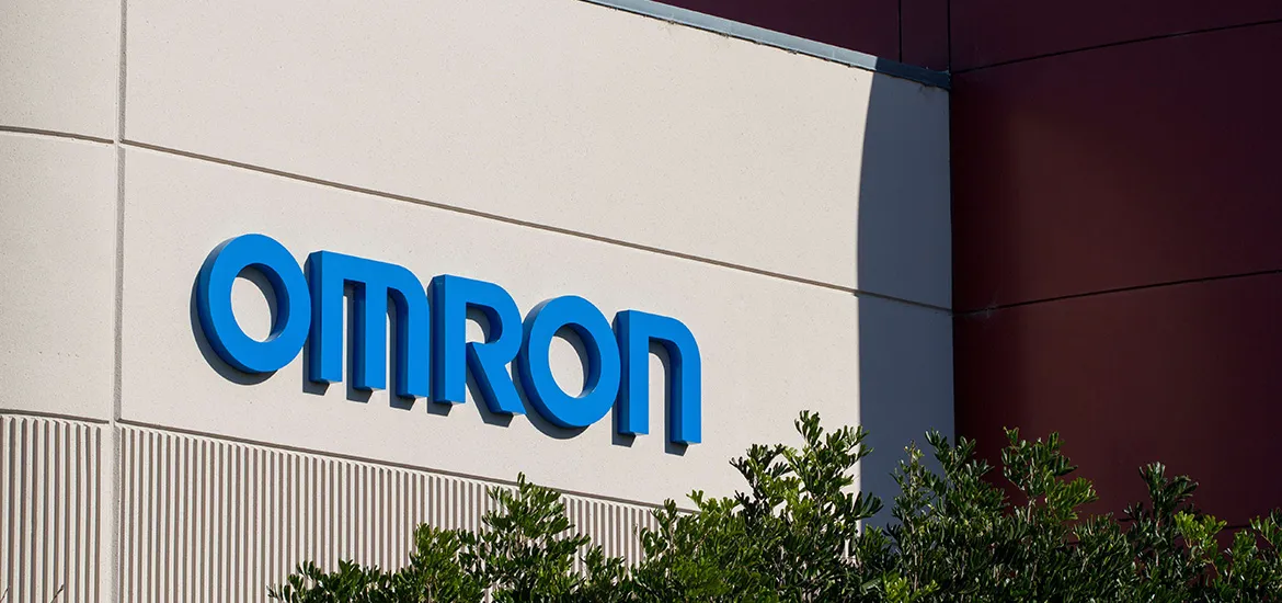 OMRON company logo displayed on the exterior wall of a building.