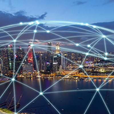 Singapore's Marina Bay skyline at dusk with a digital network overlay, illustrating global connectivity, smart city infrastructure, and digital communications.