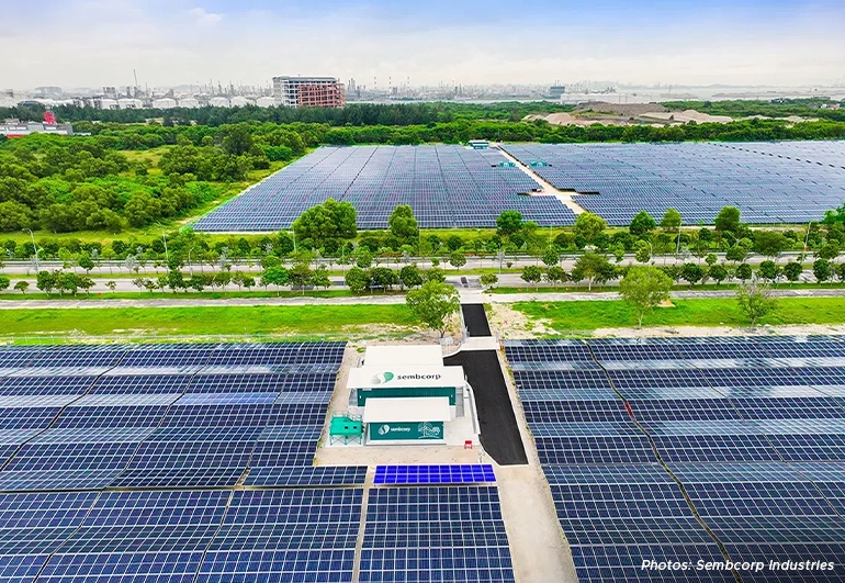 Aerial view of Sembcorp’s large-scale solar farm in Singapore featuring expansive photovoltaic panels, renewable energy infrastructure, and green landscape surroundings.