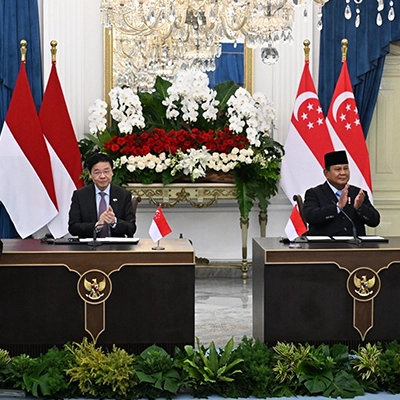 Prime Minister Lawrence Wong and Indonesian President Prabowo Subianto at the signing of a memorandum of understanding by Deputy Prime Minister and Minister for Trade and Industry Gan Kim Yong (left) and Indonesia’s Minister of Environment and head of the Environmental Control Agency, Mohammad Jumhur Hidayat.