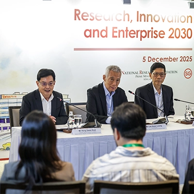 Three officials speak at a press briefing for the Research, Innovation and Enterprise 2030 agenda.