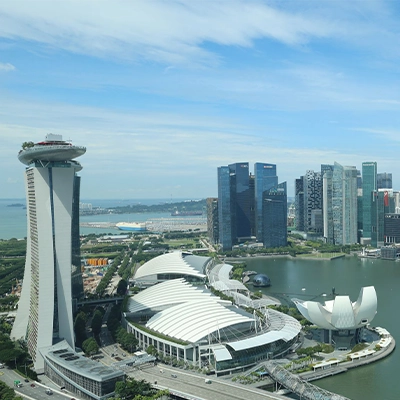 Panoramic view of Marina Bay Sands and Singapore city skyline with modern skyscrapers and waterfront.