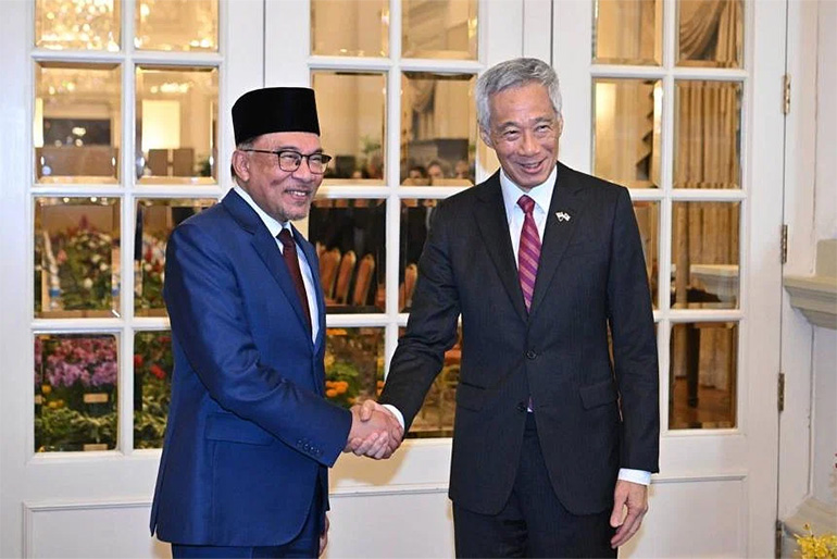 PM Anwar and PM Lee witnessed the signing of three agreements on Jan 30, 2023. Image courtesy of SPH Media.