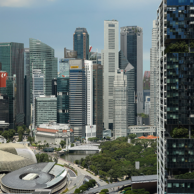 Singapore's Central Business District skyline featuring modern office towers, Marina Bay financial district buildings, and the Esplanade in the foreground.