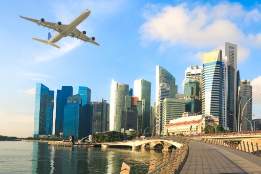 Airplane flying over Singapore City Business District image