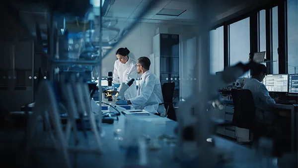 Researchers working in a state-of-the-art biopharma laboratory, symbolizing world-class manufacturing and innovation in biotechnology and pharmaceutical development.