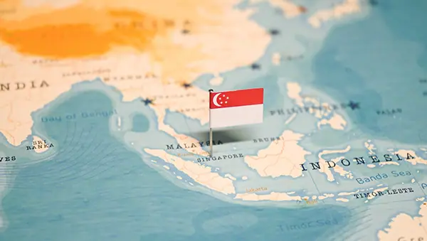 Map with Singapore flag pin, representing strategic market access in Southeast Asia.