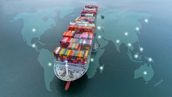 Cargo ship loaded with colorful containers sailing over a digital world map, symbolizing global trade, logistics, and free trade agreements.