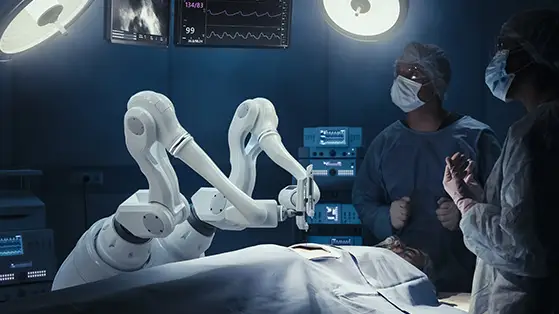 Robotic arms performing surgery with doctors observing.
