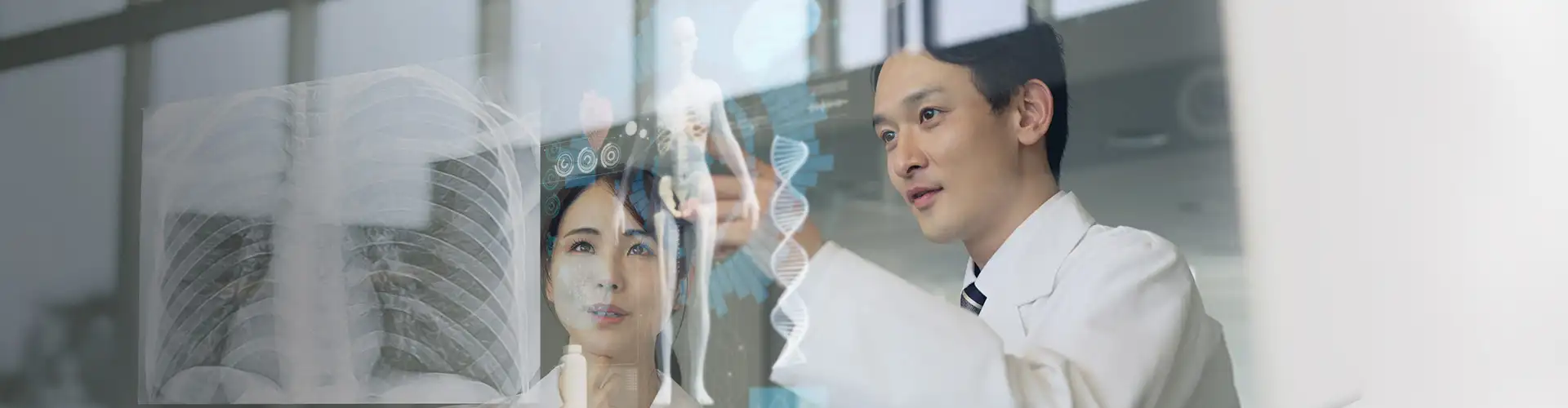 Doctors analyzing digital medical data on a transparent screen.