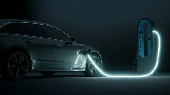 Electric vehicle charging at a glowing station, symbolizing the rise of electrification and sustainable transportation.
