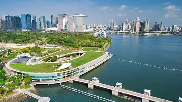 Aerial view of Singapore’s Marina Barrage and skyline, symbolizing sustainable utilities and infrastructure supporting the semiconductor industry.