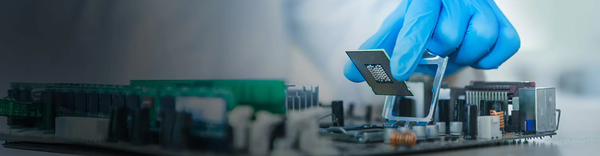 Gloved hand installing a microchip onto a circuit board, symbolizing advanced semiconductor technology and precision engineering.