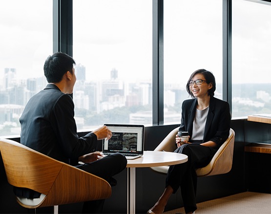 two colleagues having discussion in progress