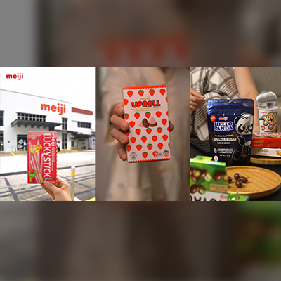 Collage of Meiji products and branding, featuring Lucky Stick, Apollo strawberry chocolate confectionery, Hello Panda snacks, and Yan Yan treats displayed alongside a Meiji facility in Singapore.