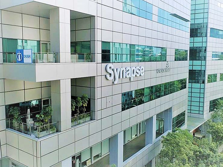 Modern office building with large glass windows.