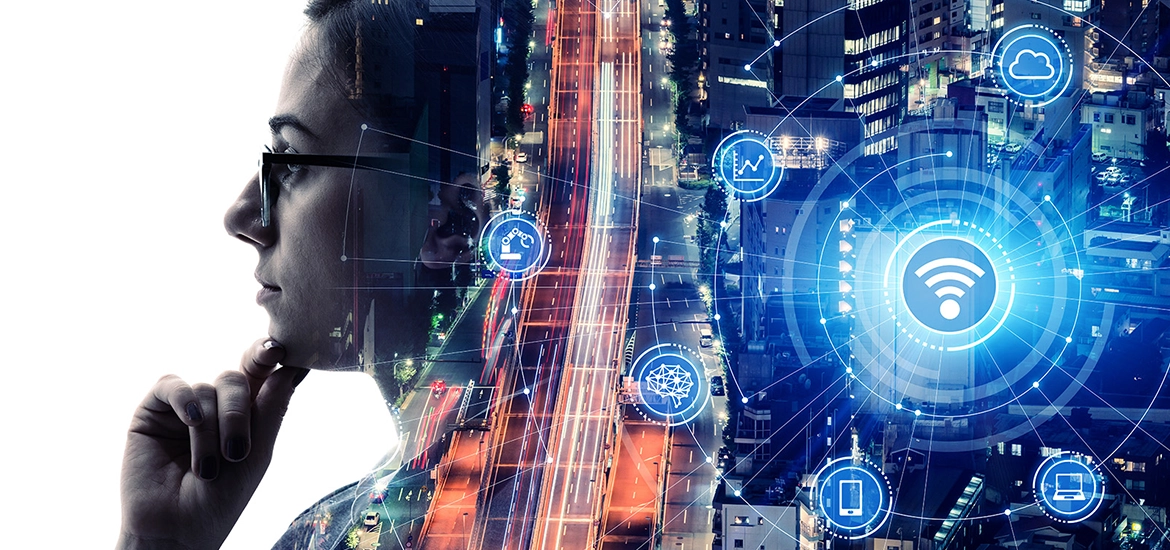 Double exposure of a thoughtful person and a smart city at night, overlaid with digital icons representing connectivity, cloud computing, data, and wireless technology.