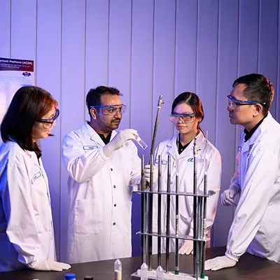 A group doing science experiment as a team.