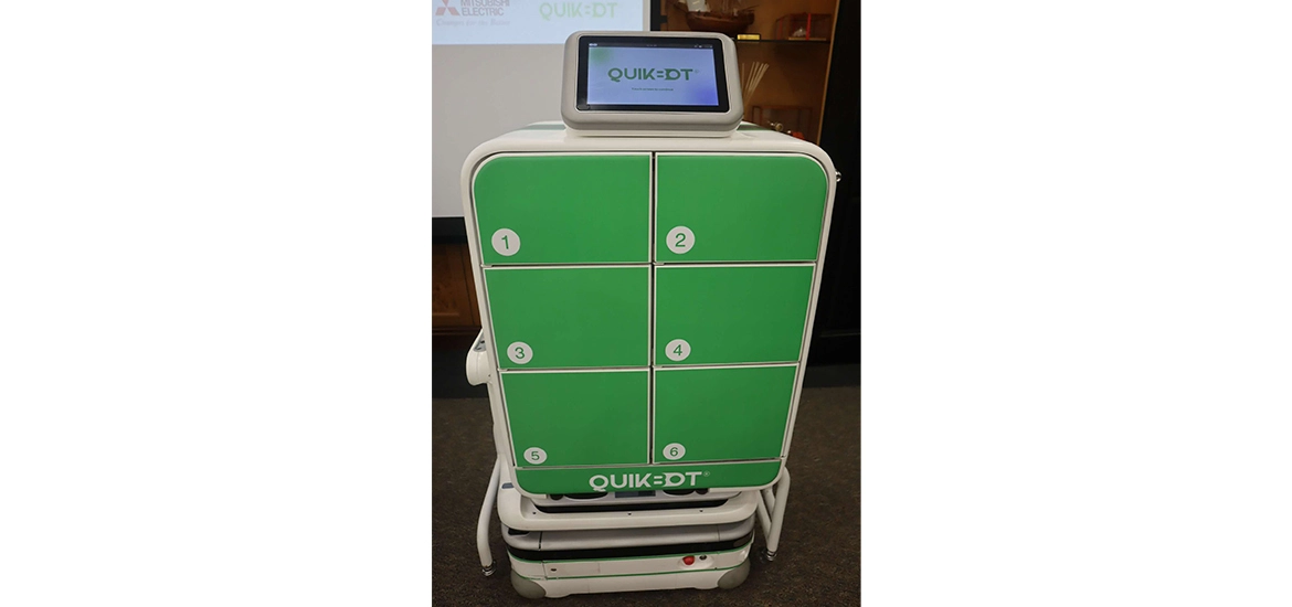QuikBot autonomous delivery robot with six numbered storage compartments.