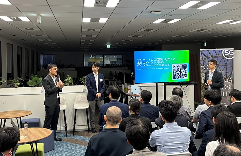 Panel discussion at a Japanese event on Singapore’s Physical AI industry, with speakers addressing an audience.