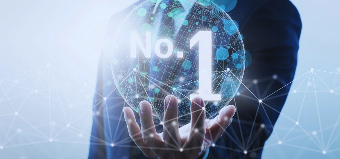Businessperson holding a digital globe with “No. 1” displayed over a connected network graphic.