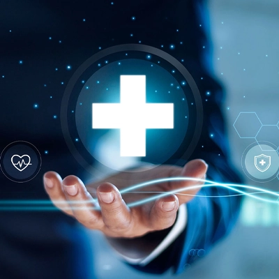 Hand reaching out toward a glowing medical cross icon, surrounded by digital health symbols and hexagonal interface graphics, representing futuristic healthcare technology.