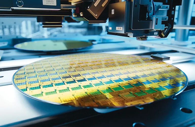 Semiconductor wafer under precision inspection equipment, representing advanced microchip manufacturing technology.