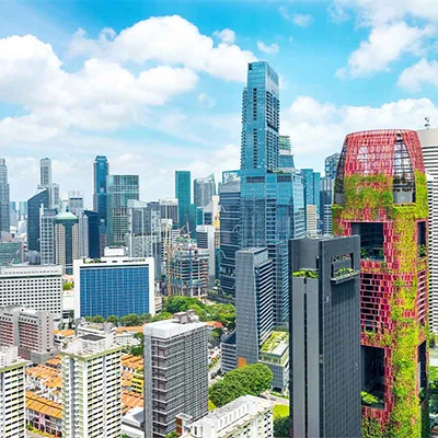 Singapore city skyline featuring modern high-rises and green architecture.
